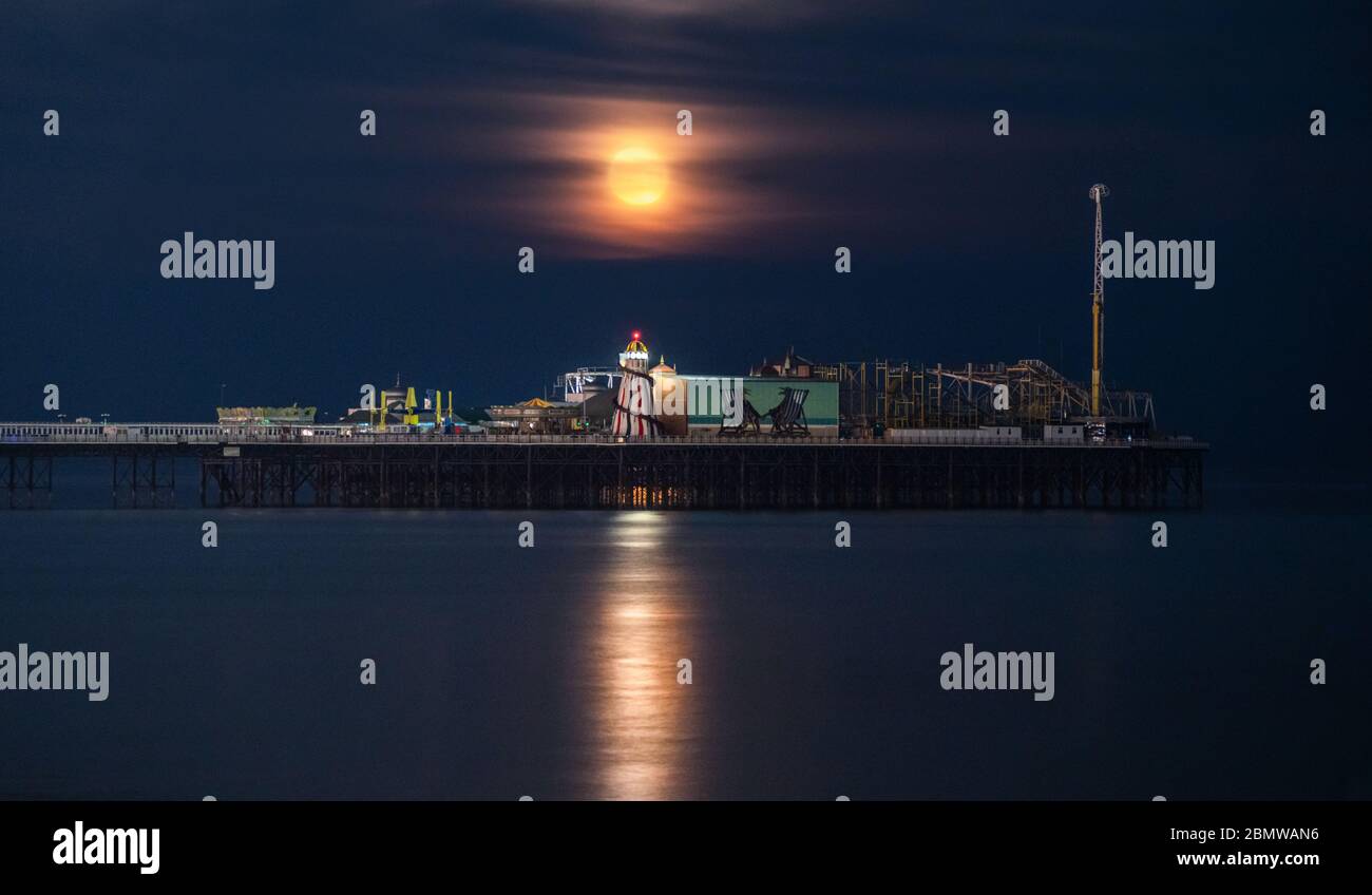 Brighton Palace Pier moonrise Stock Photo