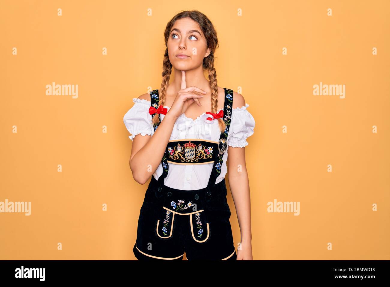 Woman eyes up finger on chin hi-res stock photography and images - Alamy