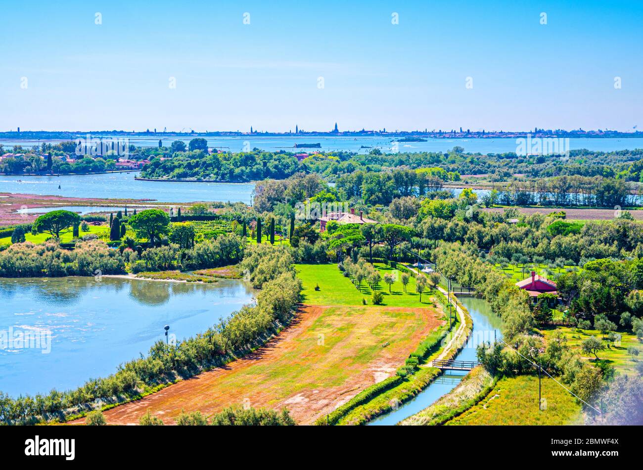 Aerial view of Torcello islands with water canal, swamp, green trees ...