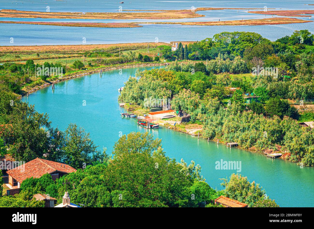 Aerial view of Torcello islands, water canal with fishing boats, green ...
