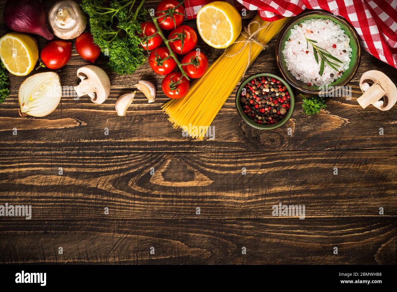 Food cooking background on wooden kitchen table Stock Photo - Alamy