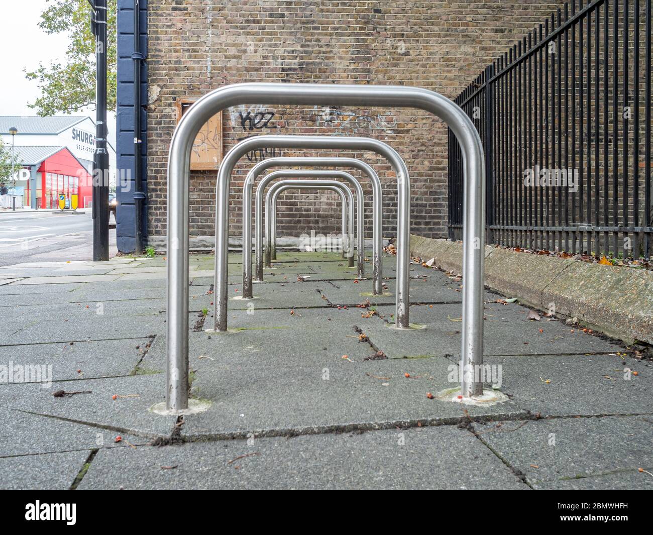 Row of empty Sheffield stand bike racks on the pavement Stock Photo