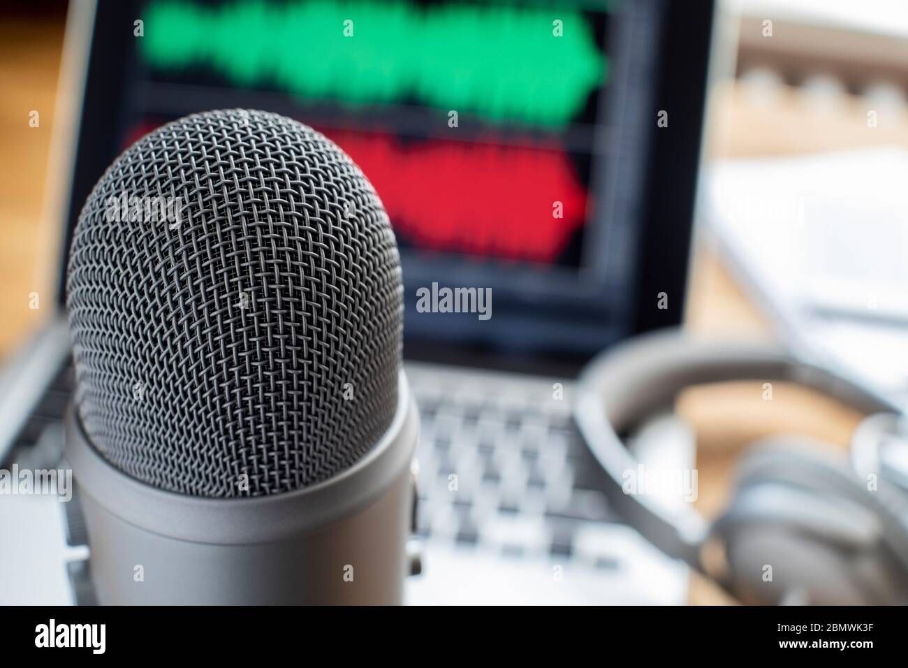 Close Up Of Microphone Laptop And Headphones For Broadcasting Podcast Stock Photo