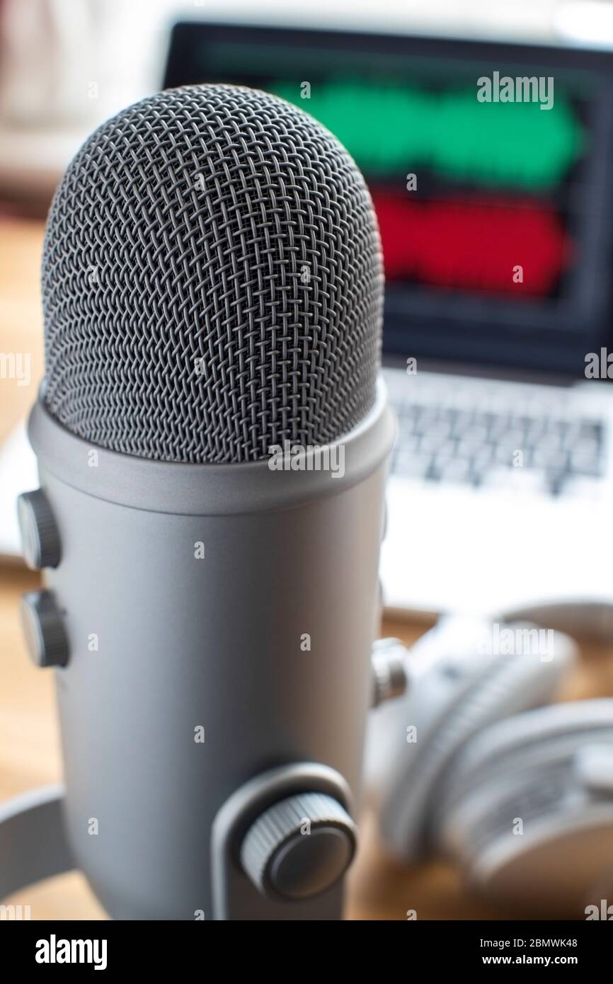 Close Up Of Microphone Laptop And Headphones For Broadcasting Podcast Stock Photo