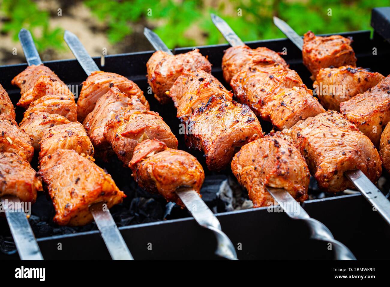 Homemade grilled pork kebab on an open grill. Outdoor food festival