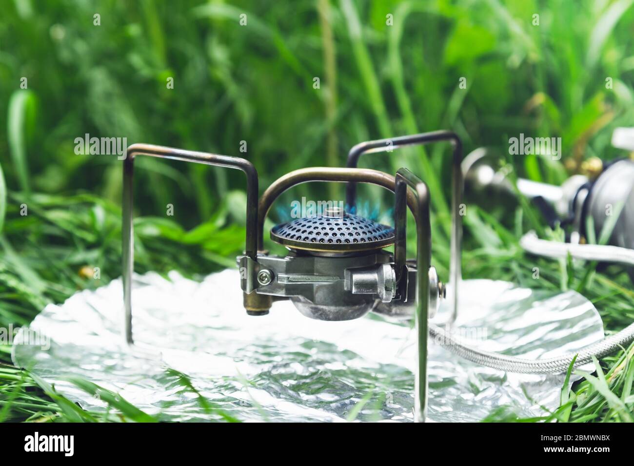 Multi-fuel burner flame on grass. Stock Photo