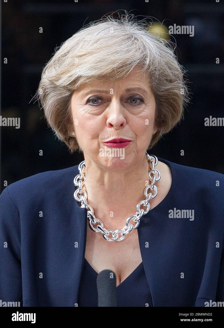 PM Theresa May speaks to the press at the lectern outside number