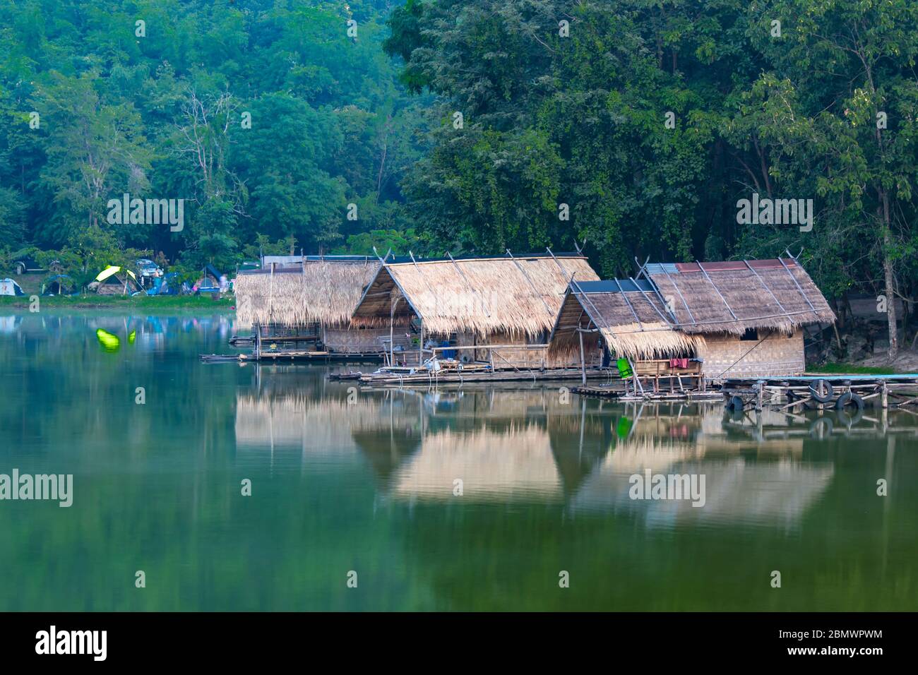 The wooden raft in the water reservoirs and mountain views. Stock Photo