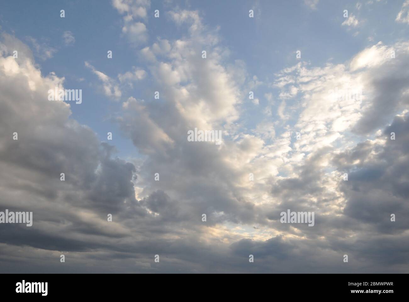 Blue cloudy sky on a summer evening. Stock Photo