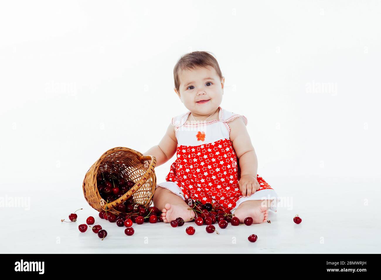 little girl with a basket of cherries berries Stock Photo - Alamy