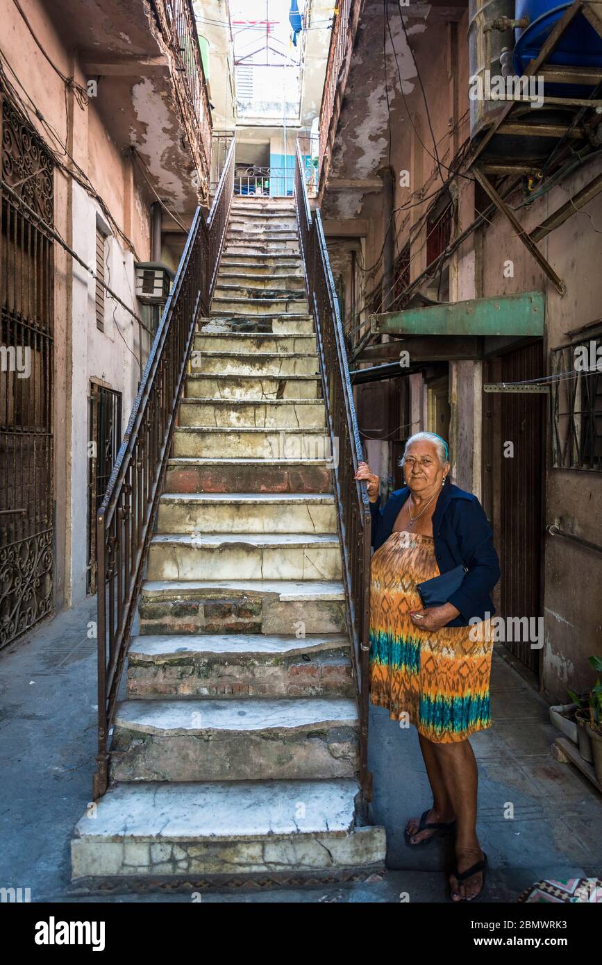 Older lady in the typical building where she has a little apartment, Old City Centre, Havana Vieja, Havana, Cuba Stock Photo