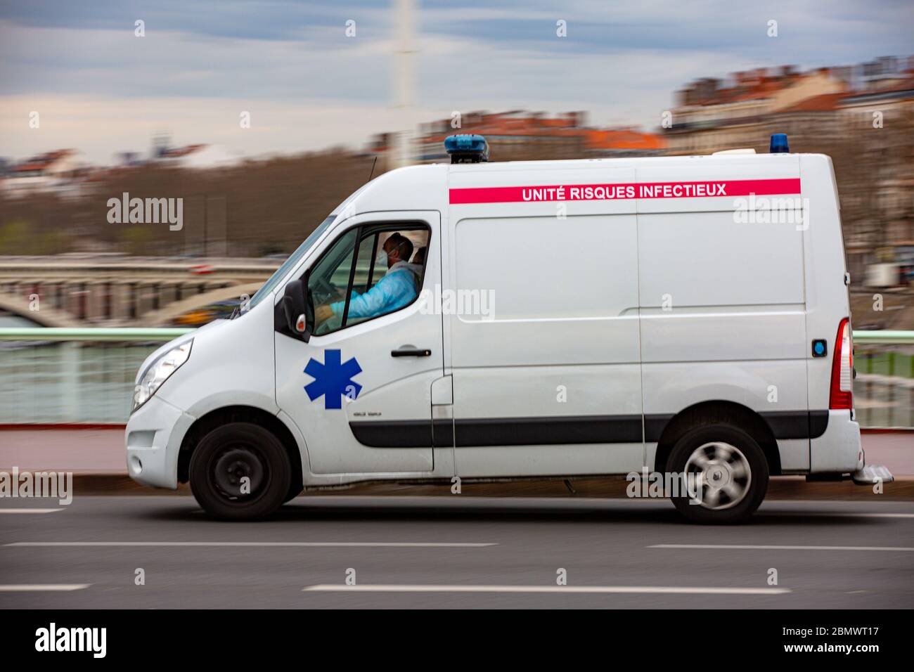 Medical car for covid viruses infected people on the Lyons street fast drive to hospital. Motion blure. Bad focus for 1:1 size. Stock Photo