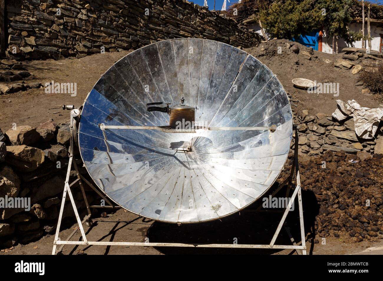 solar heater for cooking in the mountain villages of Nepal. Himalayas. Stock Photo
