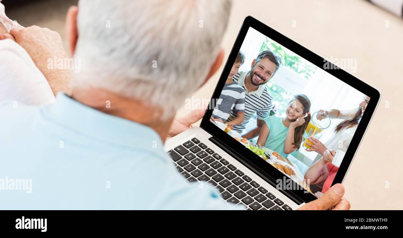 Senior man having video call on laptop. Stock Photo