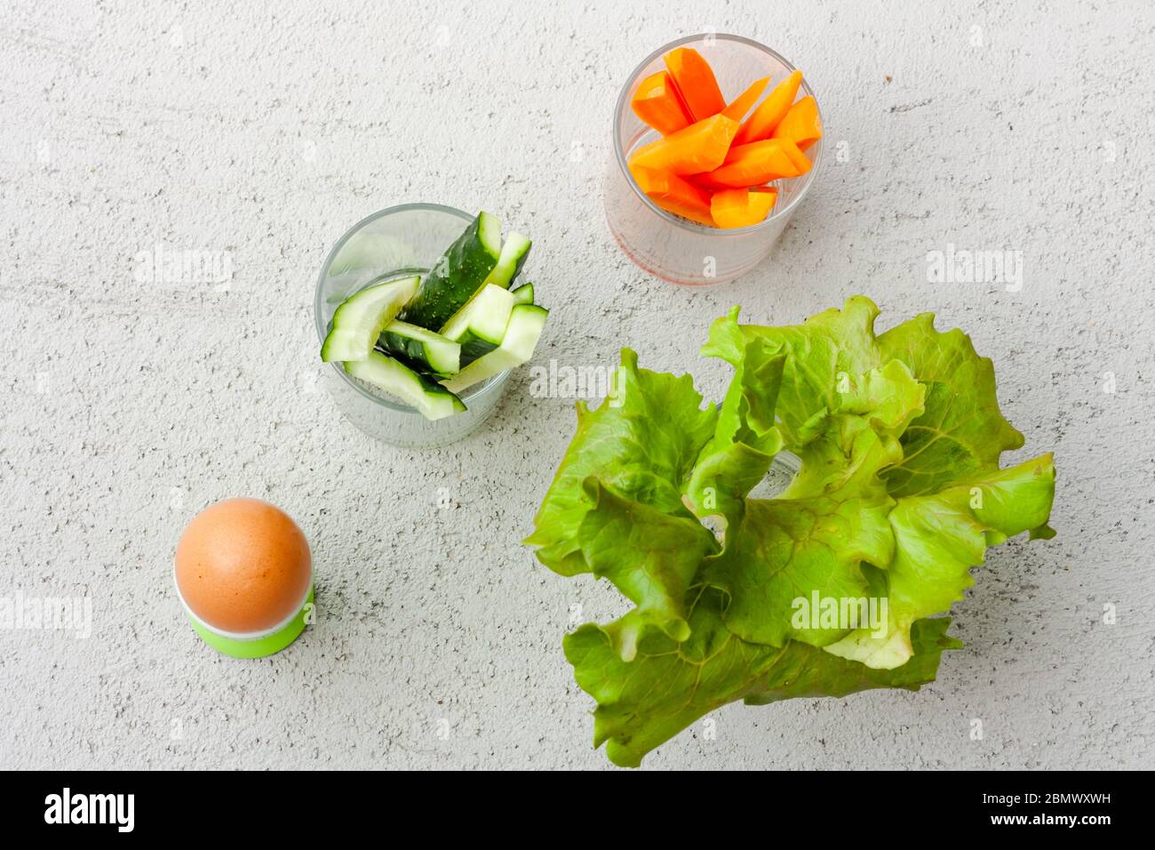 Egg, lettuce, cucumbers and carrots, cut into thin strips, served in a