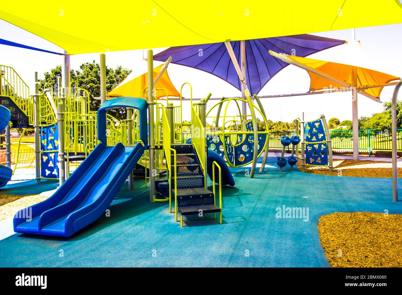 Children's Playground Set With Shade Canopies In Public Park Stock