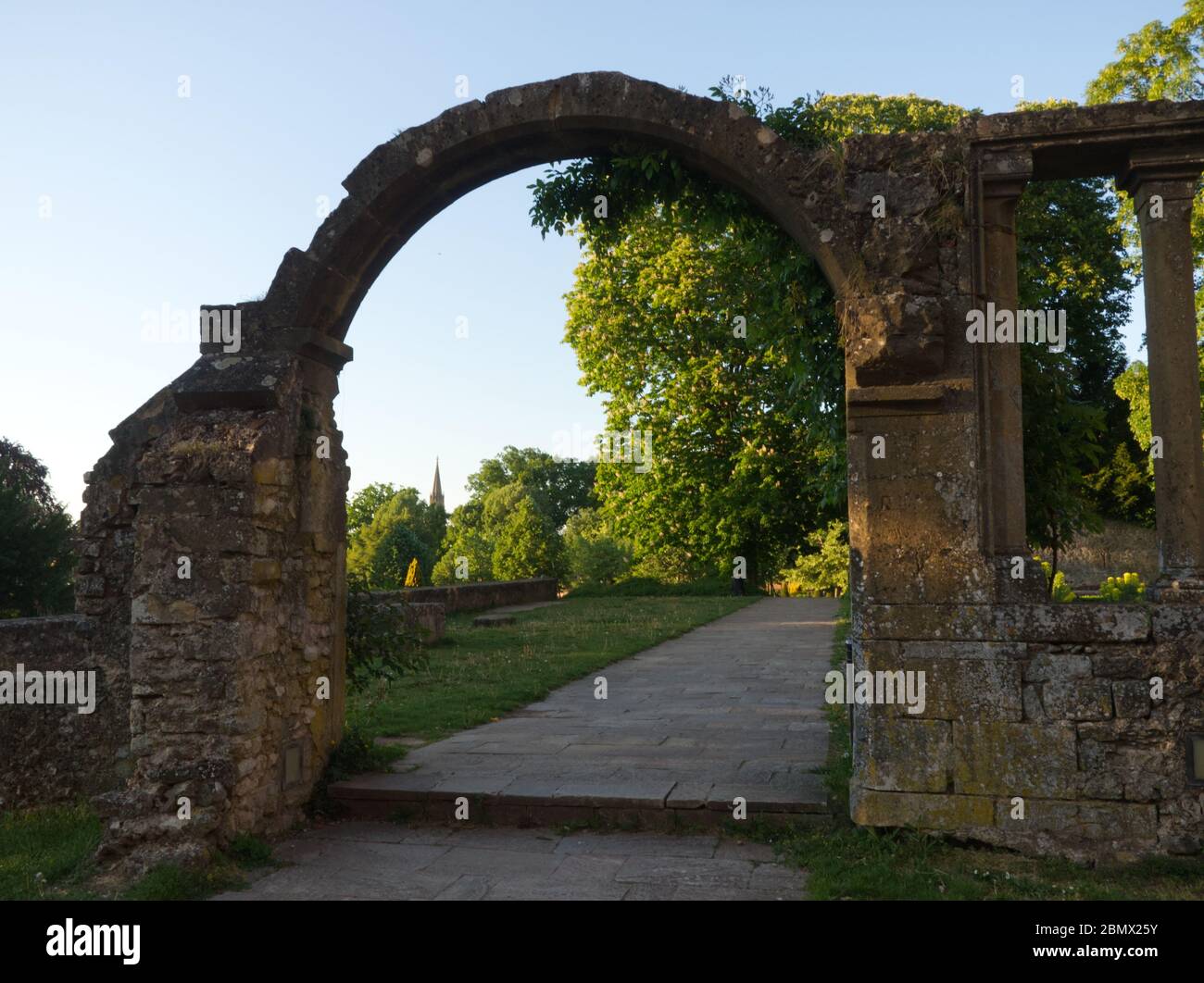 View on a city garden through a ruined gate in Metz France Stock Photo