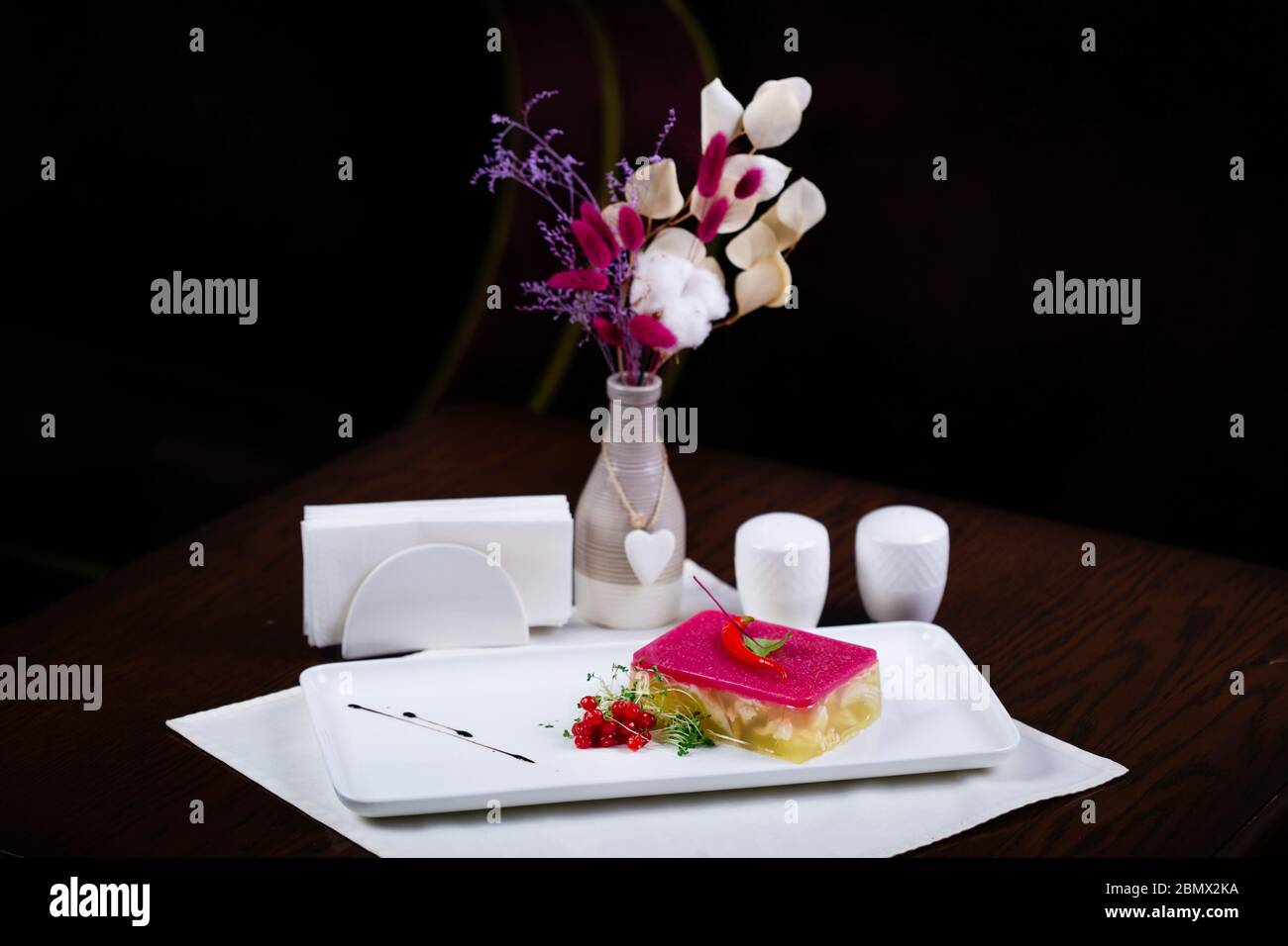 Meat galantine with vegetables, beautiful decoration aspic for festive meal selective focus Stock Photo