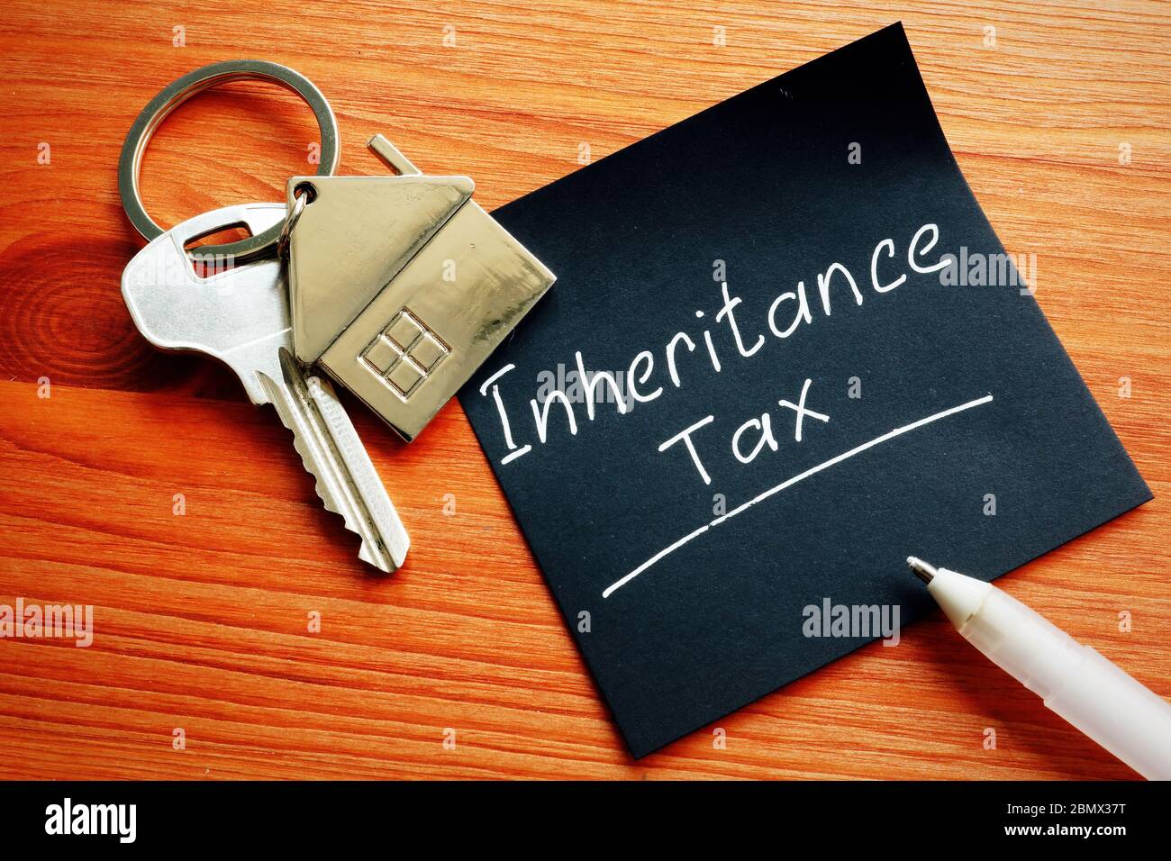 Inheritance Tax and key from inherited property. Stock Photo