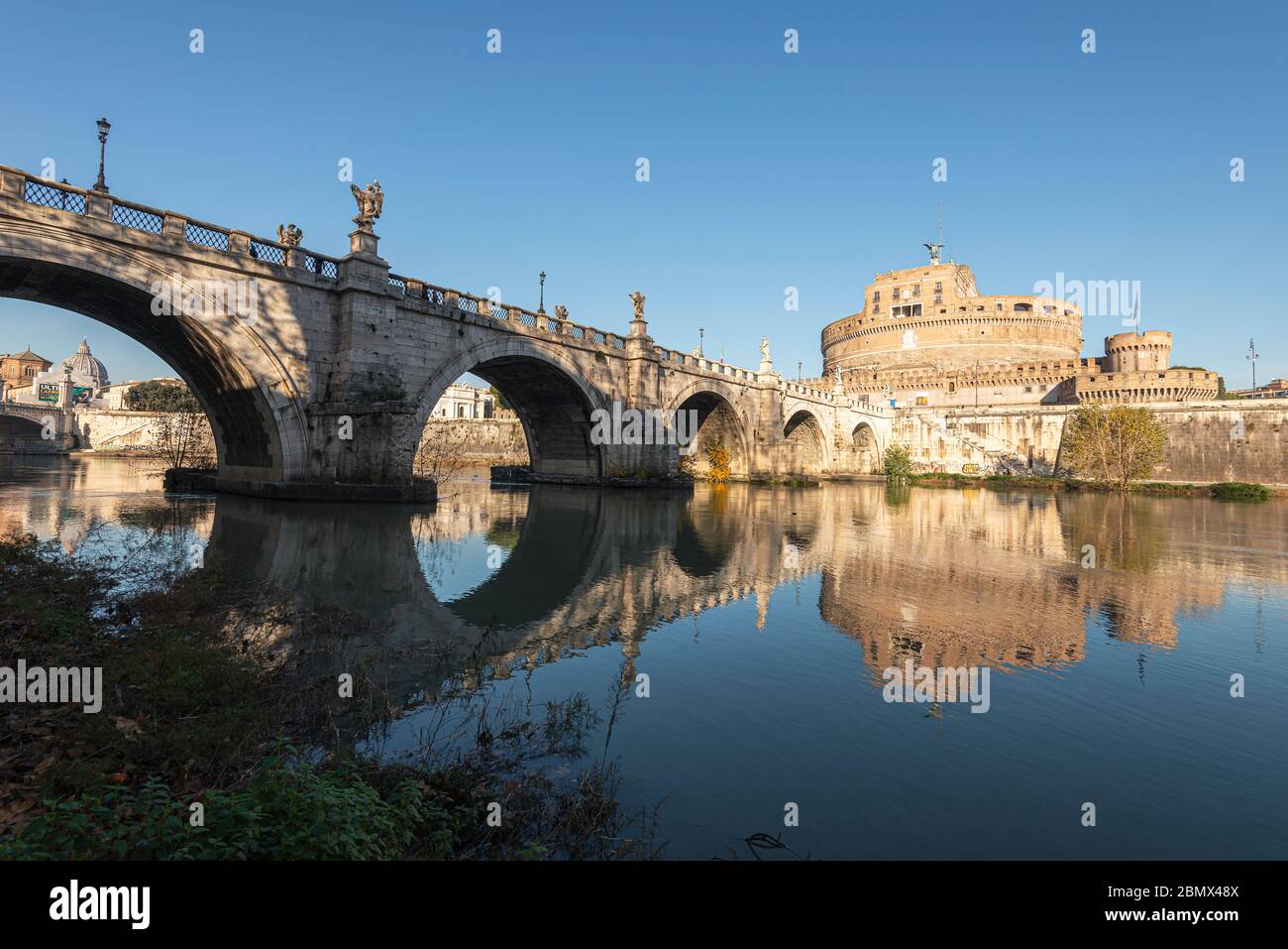 Castel Sant Angelo and Ponte Sant Angelo from the banks of the river Tiber Stock Photo