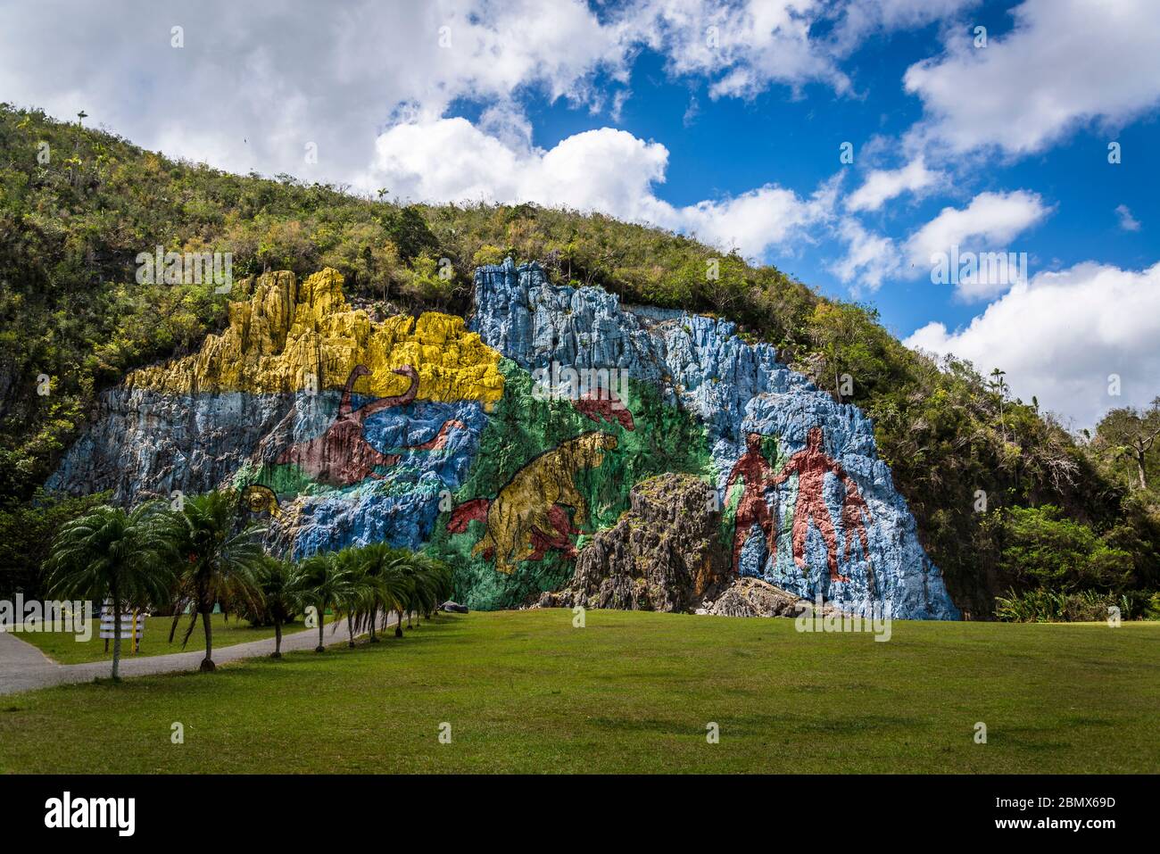 Mural of Prehistory, located in the mogote called Pita and was commissioned by Fidel Castro, Vinales Valley, Cuba Stock Photo