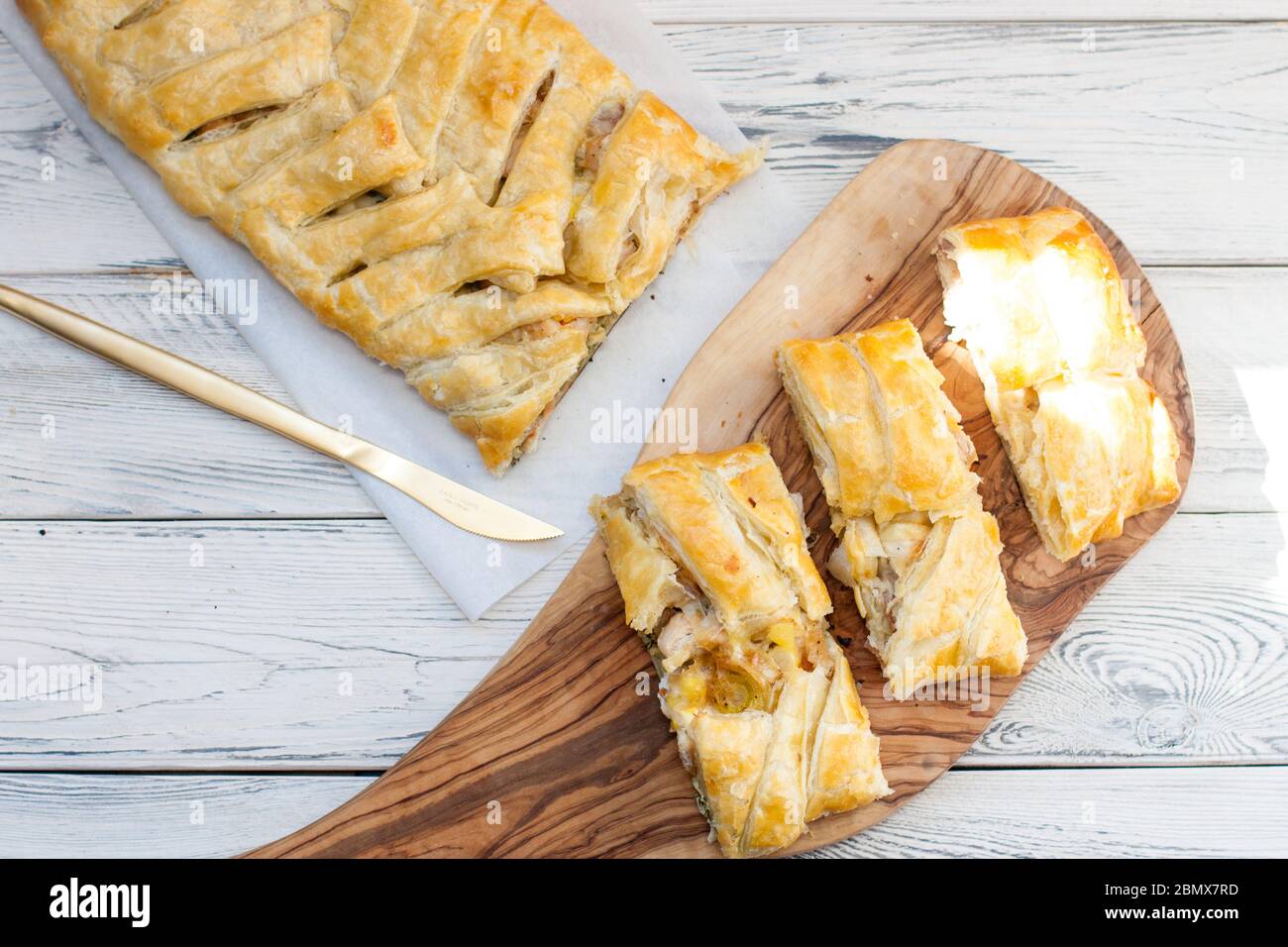 Homemade spinach and ricotta pie on wooden board. Top view. Rustic wooden background. Stock Photo