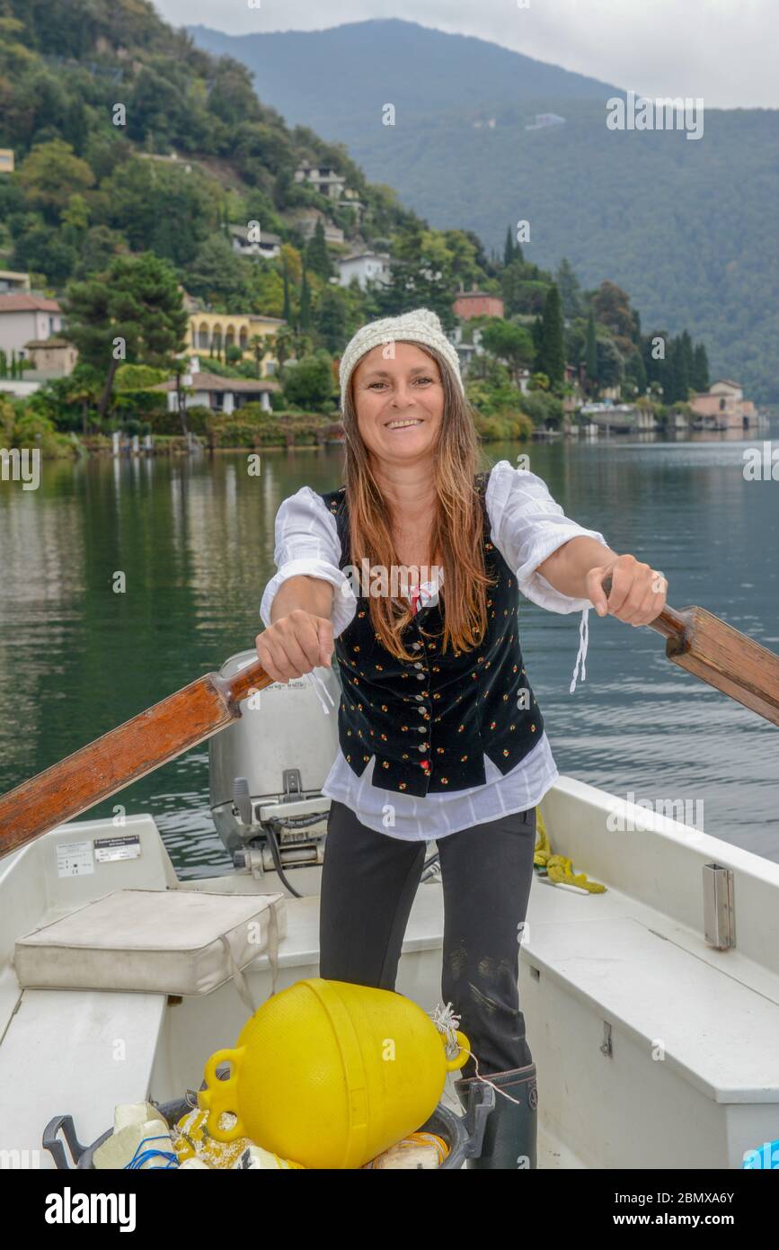 Lugano, Switzerland 18 Oktober 2016 woman in her fishing boat on