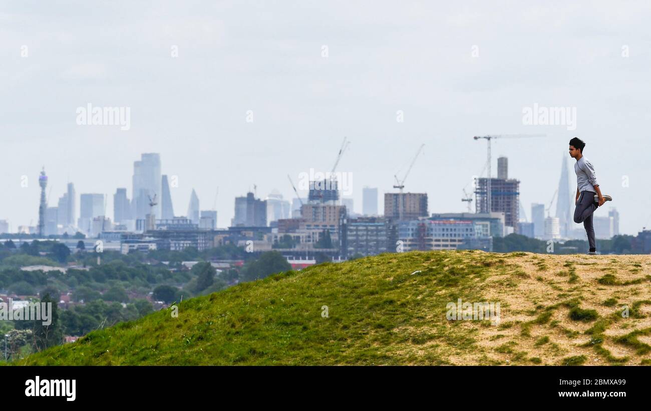 London, UK.  11 May 2020.  A man exercises at Northala Fields in west London.  The previous day, Boris Johnson, Prime Minister, delivered a speech to the nation relaxing certain aspects of coronavirus lockdown which includes unlimited amounts of exercise outdoors for individuals from 13 May.  Credit: Stephen Chung / Alamy Live News Stock Photo