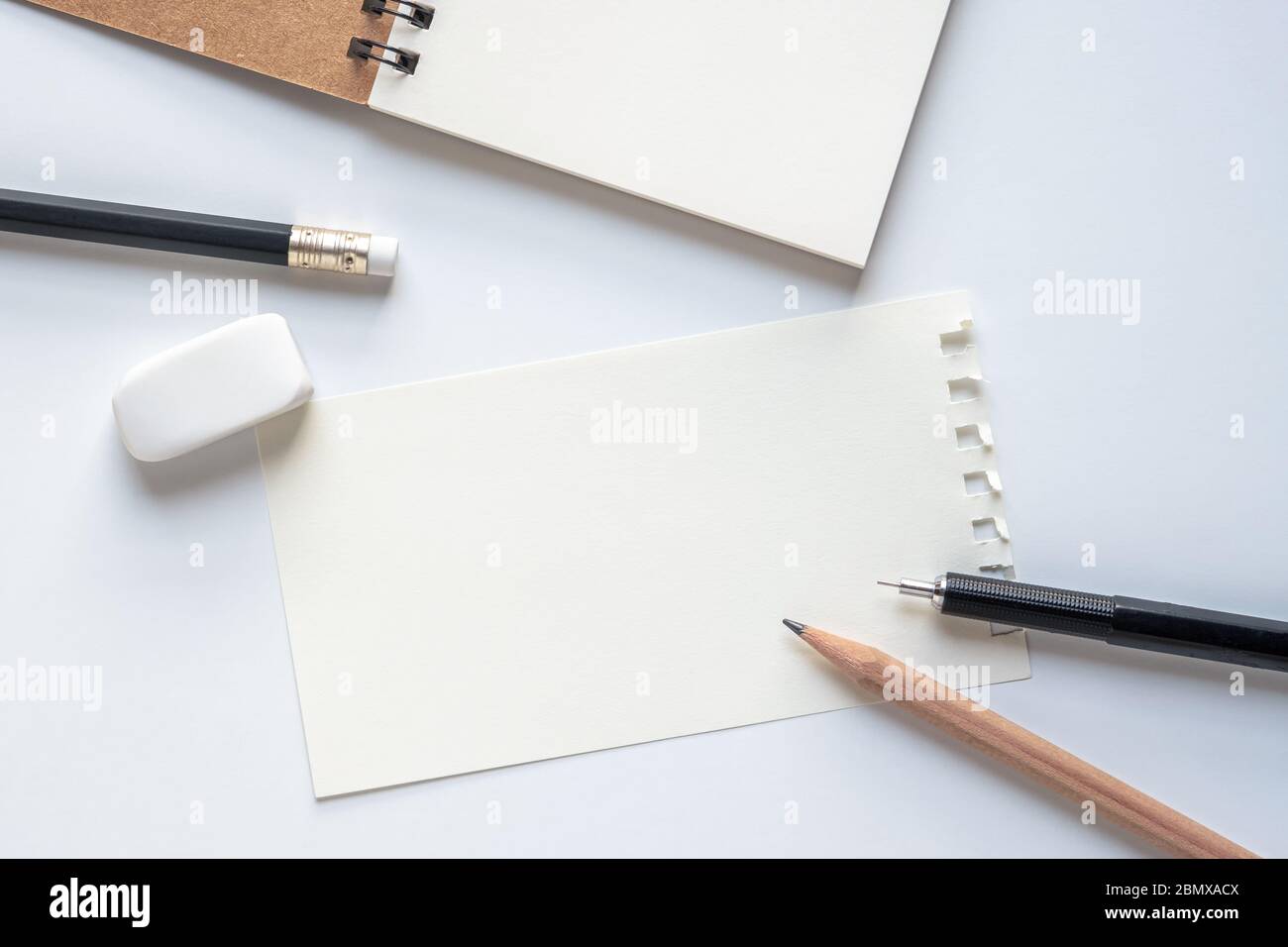 blank sketchbook and pencils for drawing on brown artistic background top  view Stock Photo