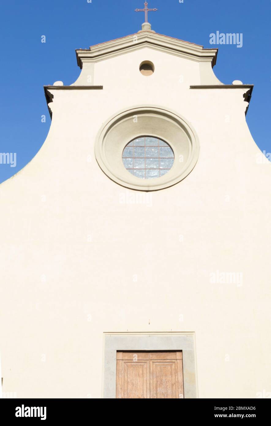 Detail of the minimal white facade of Santo Spirito church in Florence, Tuscany, Italy Stock Photo