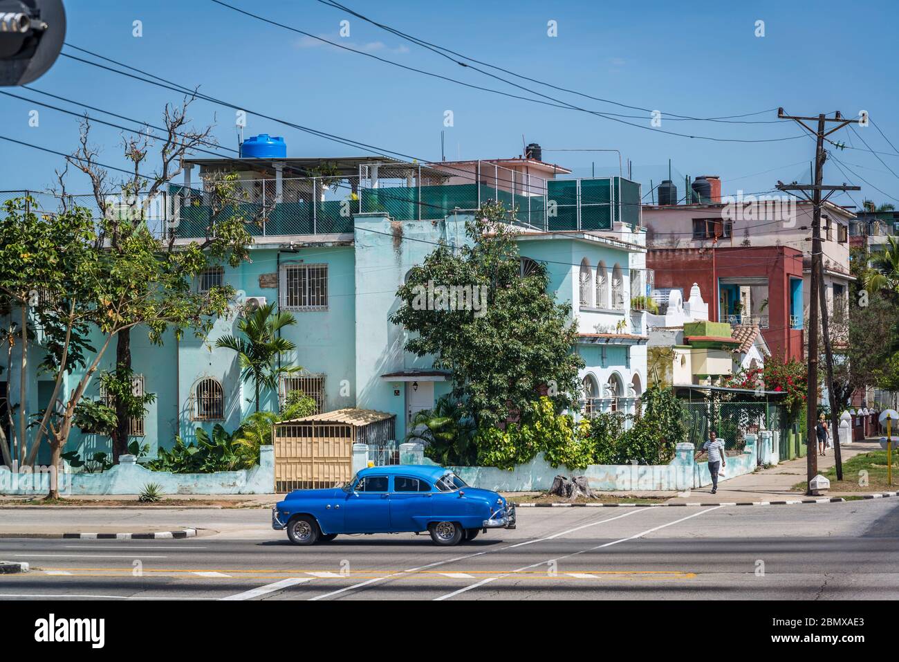 Vintage car driving through, Vedado district, Havana, Cuba Stock Photo