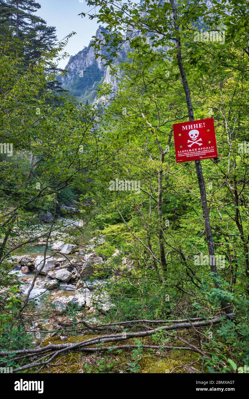 Mines warning sign near Tjentiste, Sutjeska National Park, Dinaric Alps, Republika Srpska, Bosnia and Herzegovina, Southeastern Europe Stock Photo