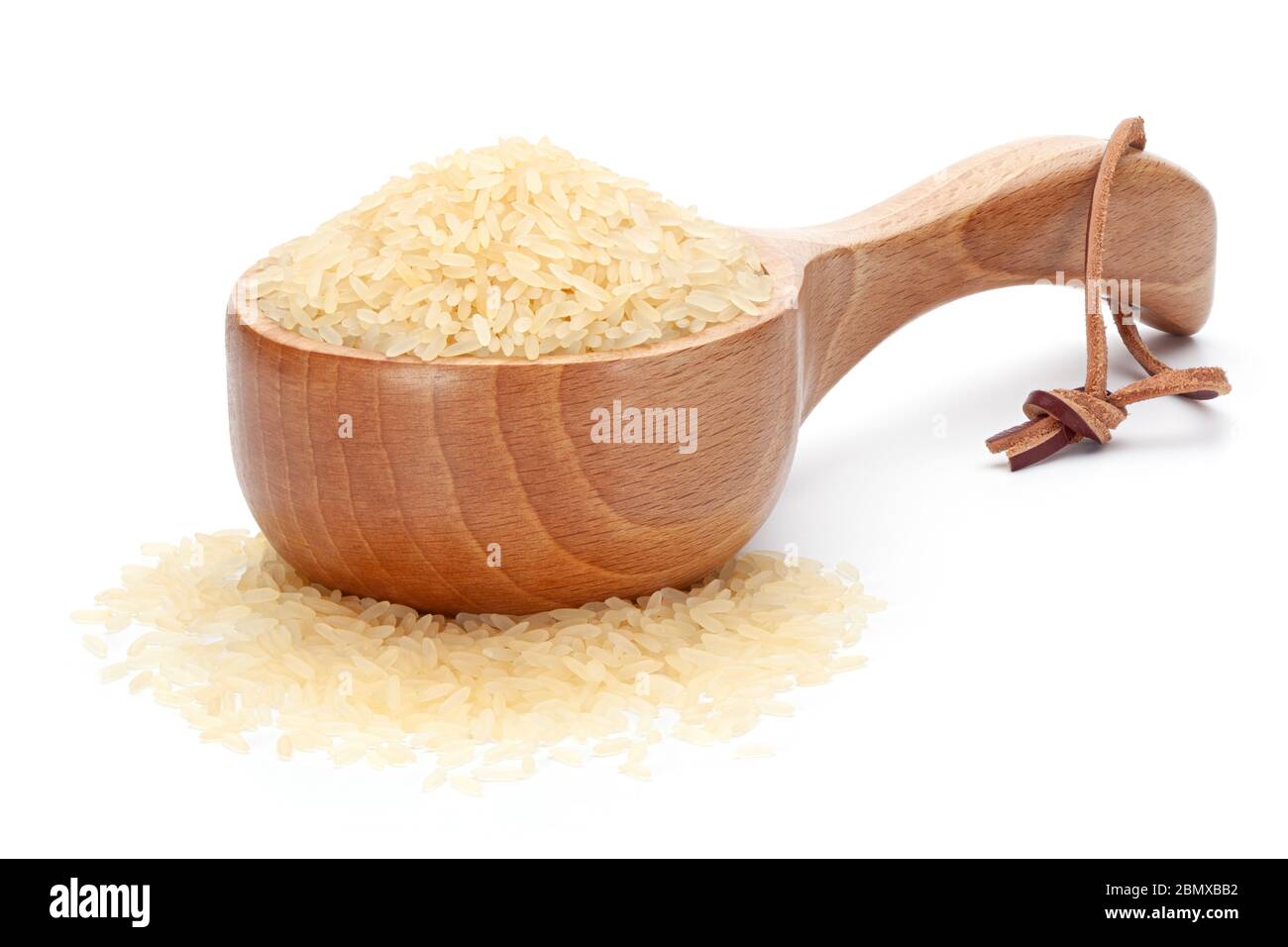 Rice in woodenware, isolated on the white background. Stock Photo