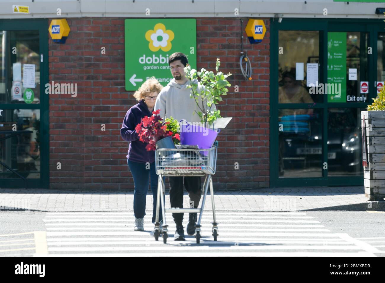 Swansea, UK. 11th May, 2020. A man leaves Dobbies Garden Centre in Swansea after the Welsh Government relaxed rules on the opening of centre's in Wales, with England following suit on Wednesday 13th May. Garden Centres and nurserys will be able to open with social distancing measures in place.   Credit: Robert Melen/Alamy Live News Stock Photo