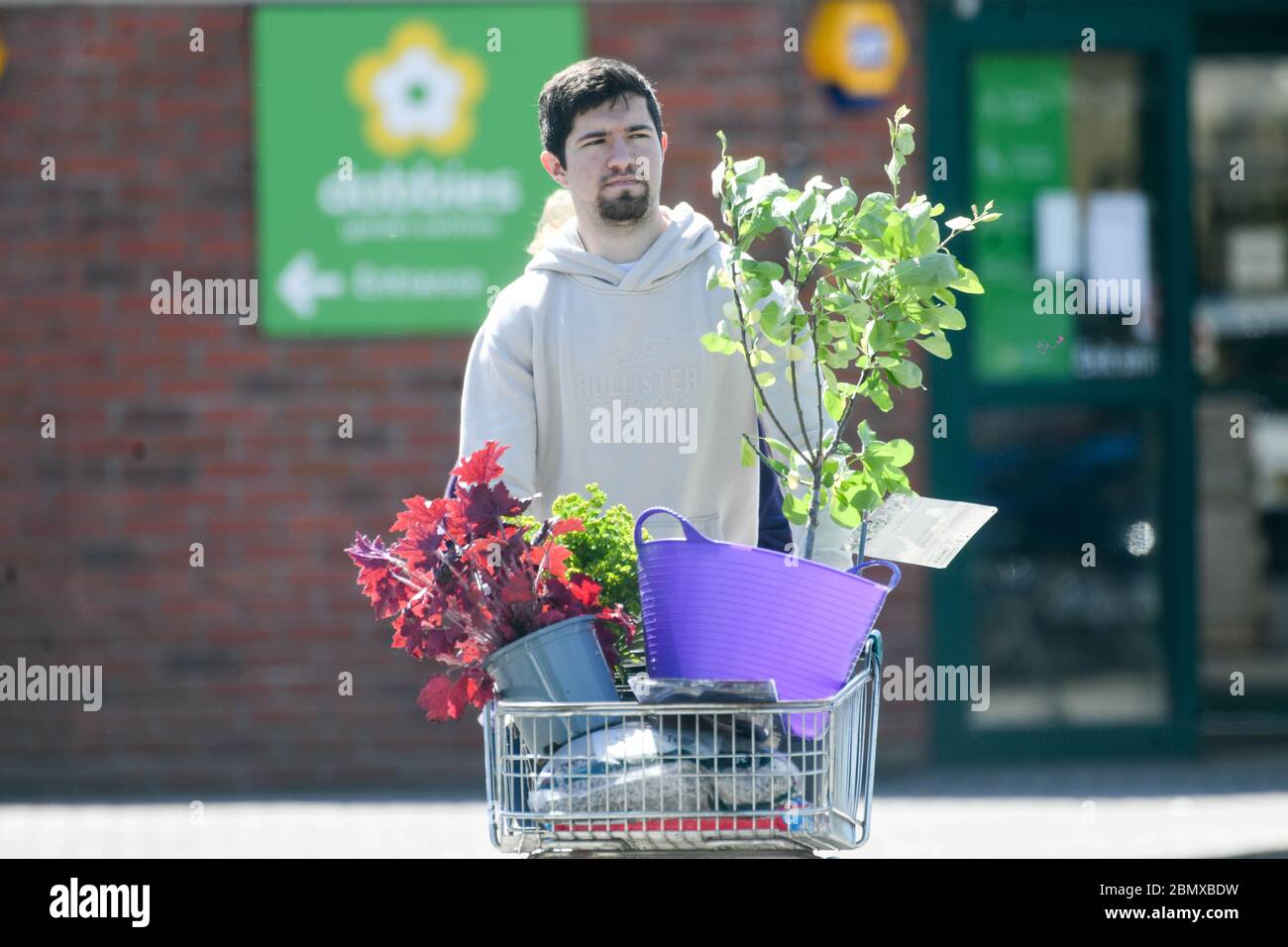 Swansea, UK. 11th May, 2020. A man leaves Dobbies Garden Centre in Swansea after the Welsh Government relaxed rules on the opening of centre's in Wales, with England following suit on Wednesday 13th May. Garden Centres and nurserys will be able to open with social distancing measures in place.   Credit: Robert Melen/Alamy Live News Stock Photo