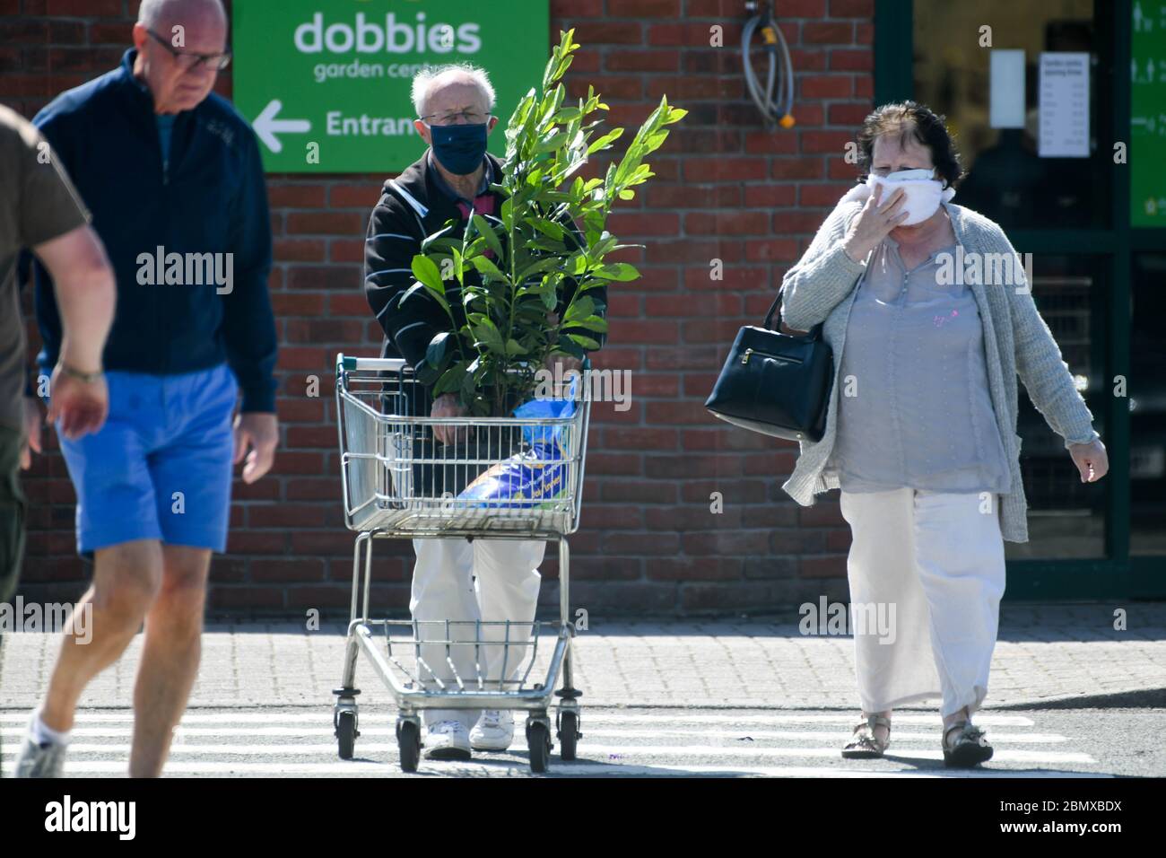 Swansea, UK. 11th May, 2020. A couple leave Dobbies Garden Centre in Swansea after the Welsh Government relaxed rules on the opening of centre's in Wales, with England following suit on Wednesday 13th May. Garden Centres and nurserys will be able to open with social distancing measures in place.   Credit: Robert Melen/Alamy Live News Stock Photo