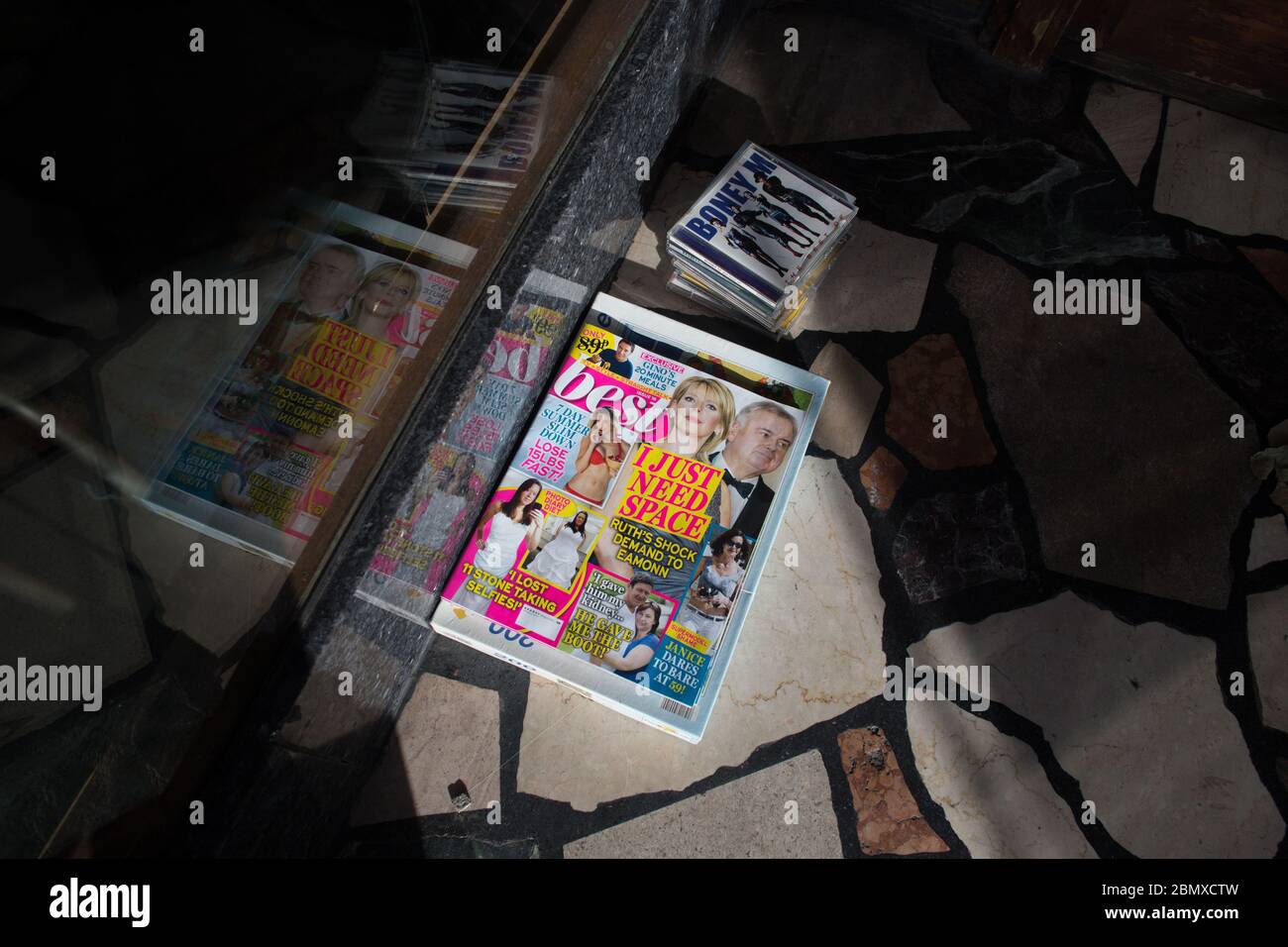 A copy of 'Best' celebrity gossip magazine (and Boney M music CD) left outside a charity shop. Stock Photo
