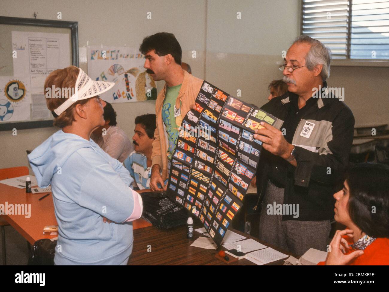 CARACAS, VENEZUELA, DECEMBER 4, 1988 - Poll worker shows ballot during voting in 1988 Presidential election. Stock Photo