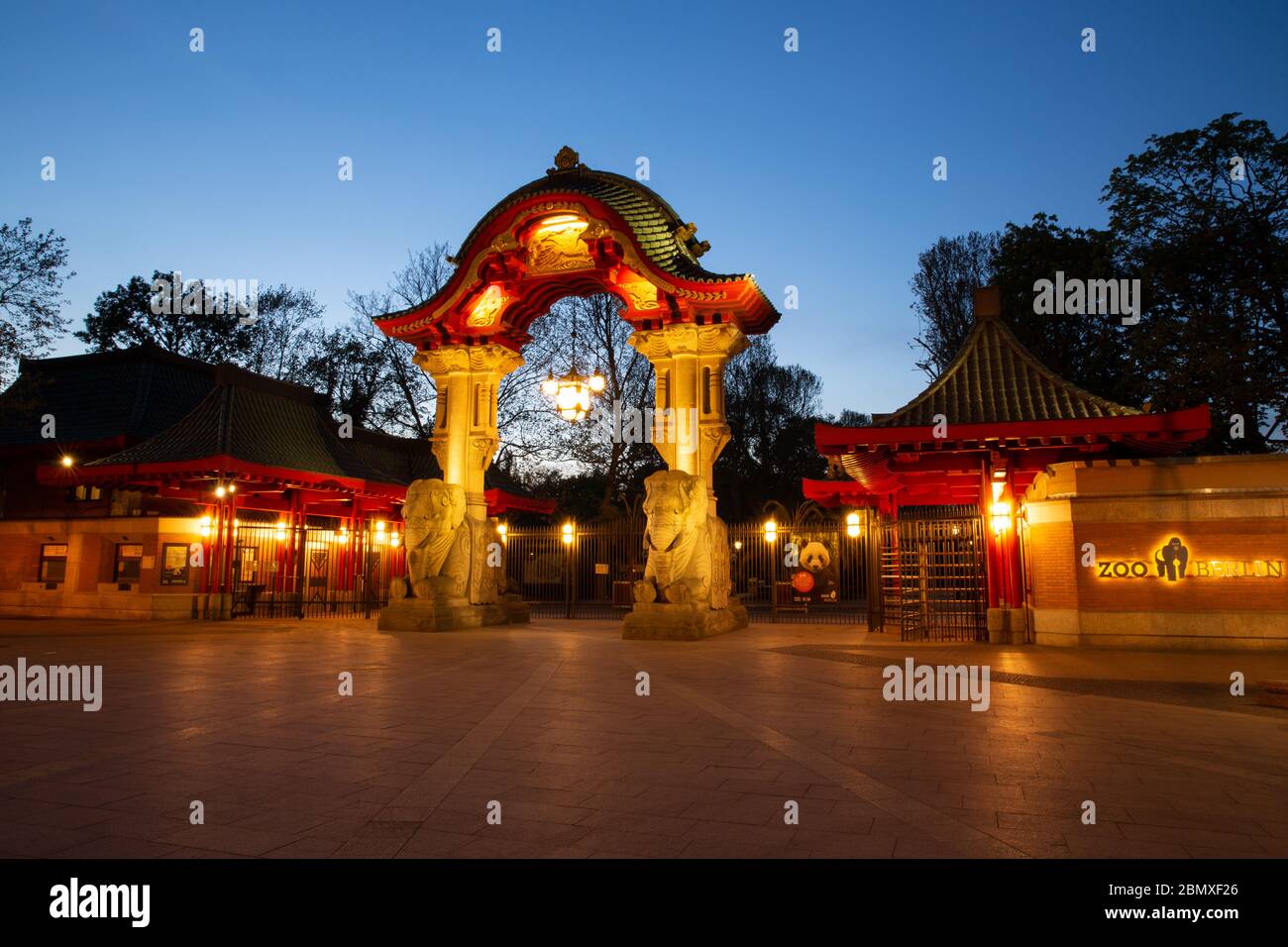 Berlin, Germany. 23rd Apr, 2020. The Elephant Gate at the entrance of Budapester Straße to the Berlin Zoo in the Blue Hour. Credit: Gerald Matzka/dpa-Zentralbild/ZB/dpa/Alamy Live News Stock Photo