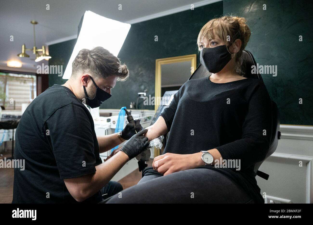 Stuttgart Germany 11th May 2020 An Employee Of The Tattoo Studio Mommy I M Sorry Tattoos A Customer On Her Forearm From 11 May Onwards Relaxed Corona Rules Apply In Baden Wurttemberg Among Other