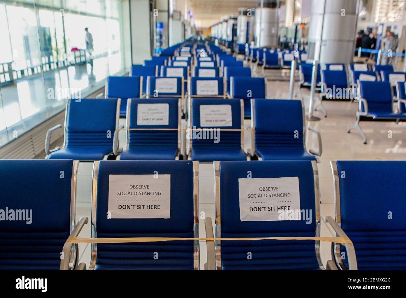 Manila. 11th May, 2020. Social distancing signs are placed on seats at the Manila Ninoy Aquino International Airport in the Philippines, May 11, 2020. All foreigners and Filipinos arriving in the Philippines need to undergo testing for the COVID-19 and quarantine to stem the spread of the virus, Presidential spokesperson Harry Roque said on Monday. Credit: Rouelle Umali/Xinhua/Alamy Live News Stock Photo