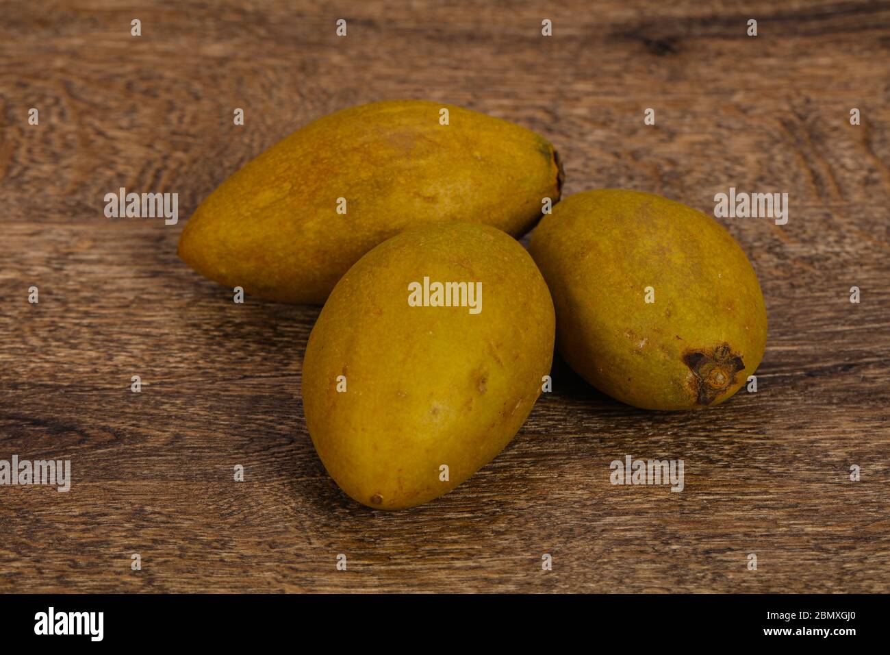 Exotic tropical tasty fruit - Sapodilla in the plate Stock Photo