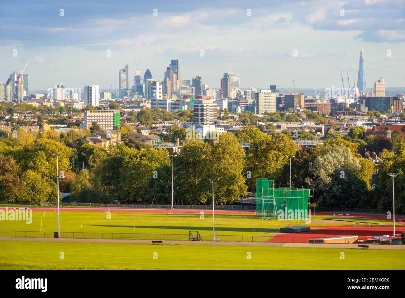 Parliament Hill Fields Athletics Track and London city skyline from Hampstead Heath Stock Photo