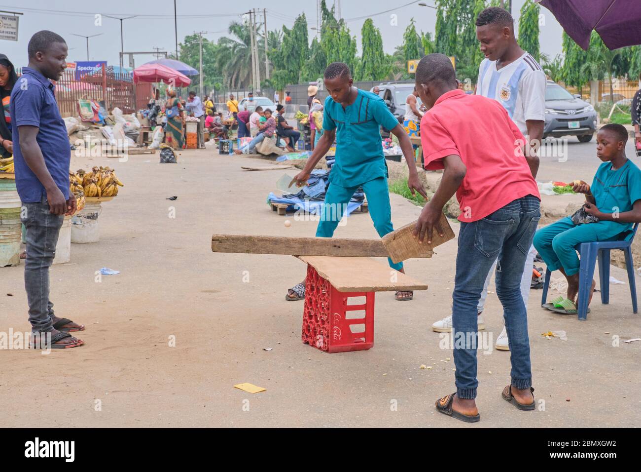 Boys play a game of ping pong on a improvised table in Lagos, Nigeria. Stock Photo