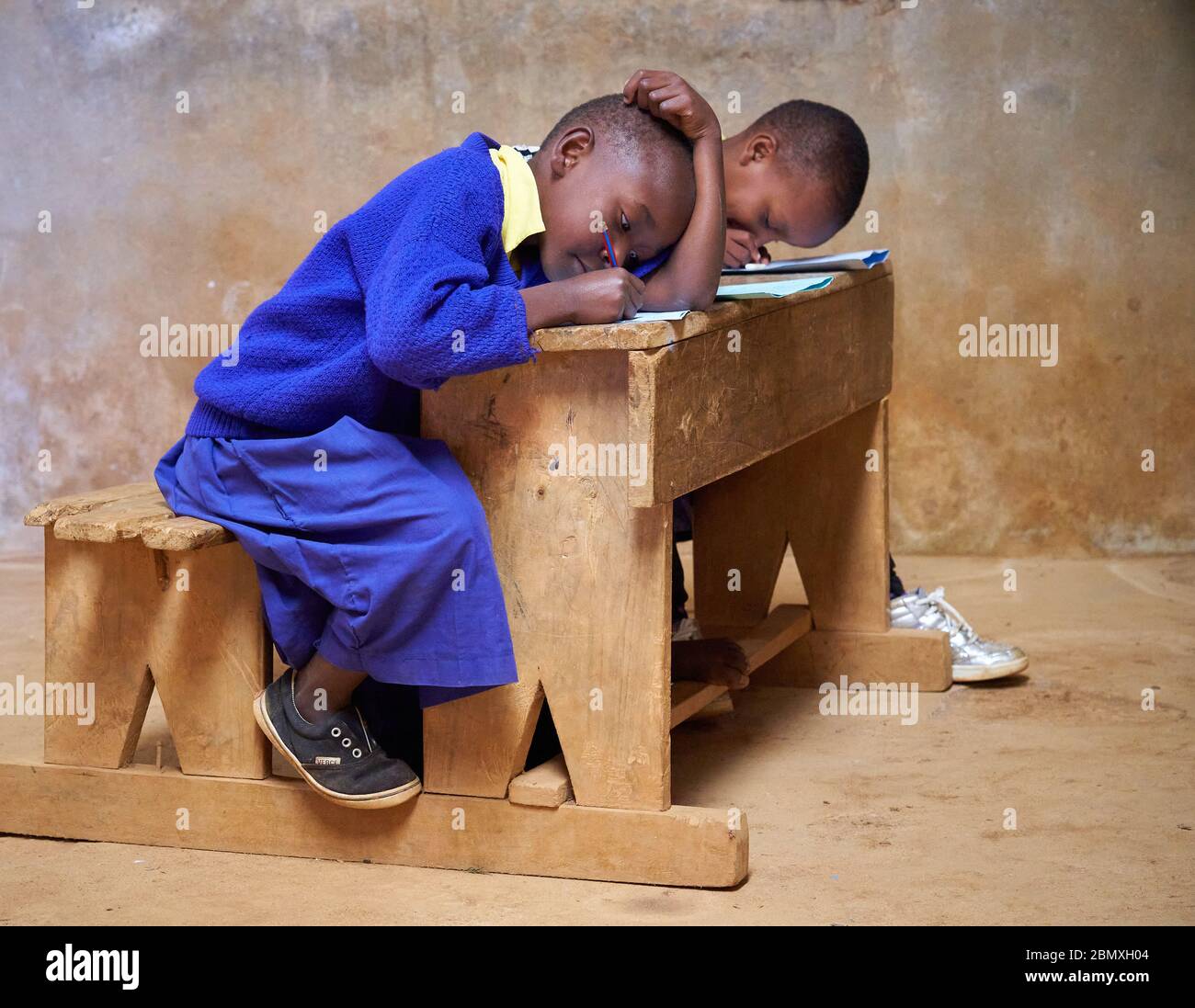 Children working at a school desk in a small remote school high in the