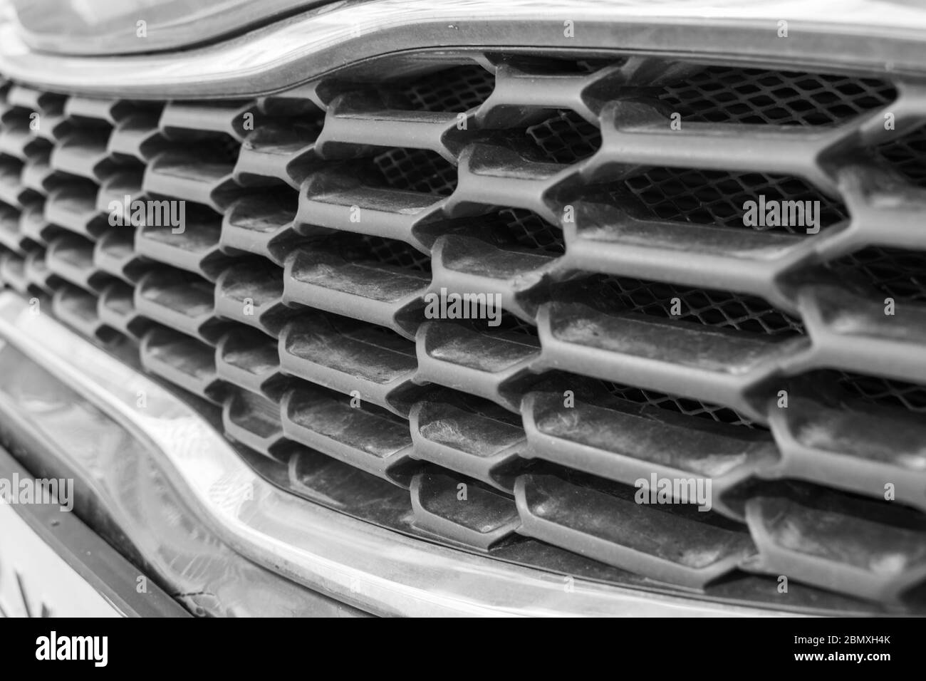 Front Bumper Of The Car. Front Bumper Grille Black Plastic Stock Photo ...