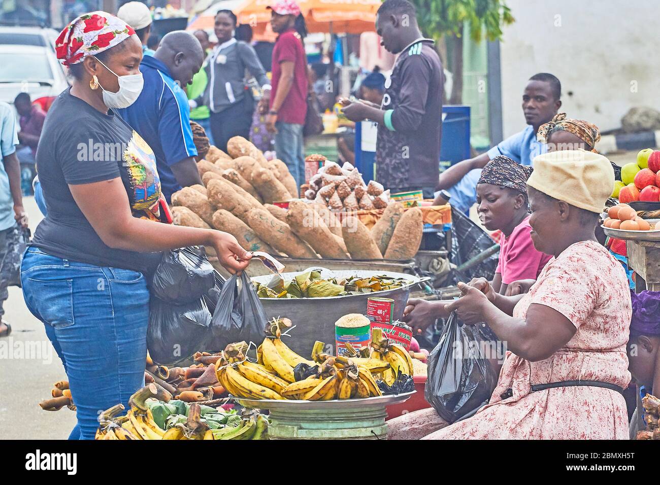 A woman shopping at an open air market during Covid19 lockdown in