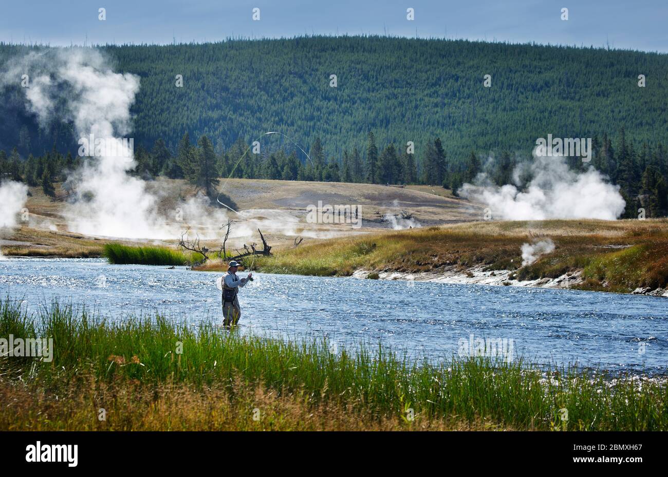 Fly fishing on the firehole river Stock Photo
