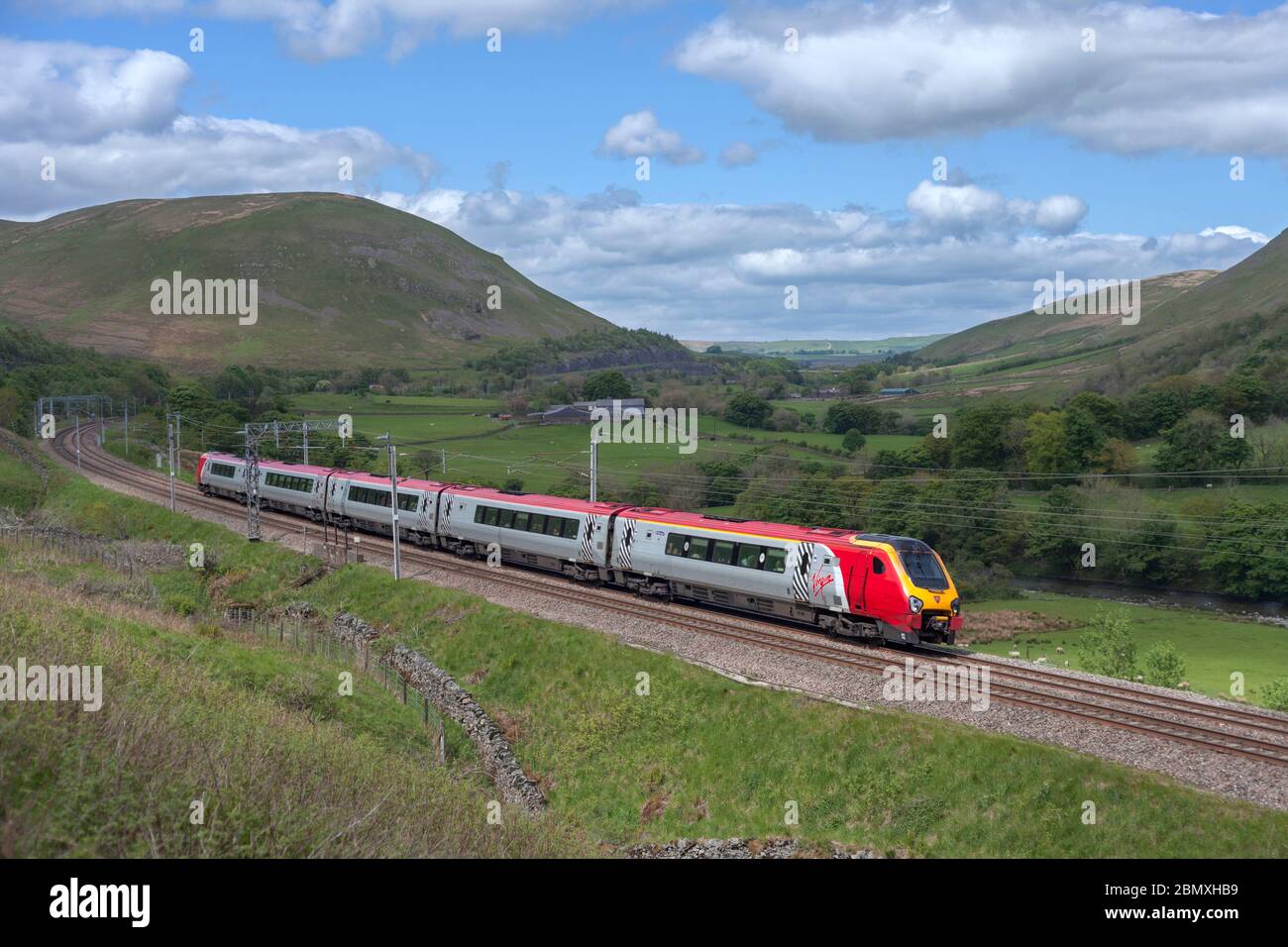 Virgin Trains class 221 Bombardier voyager train 221112 in the countryside on the west coast mainline in the lune gorge in Cumbria Stock Photo