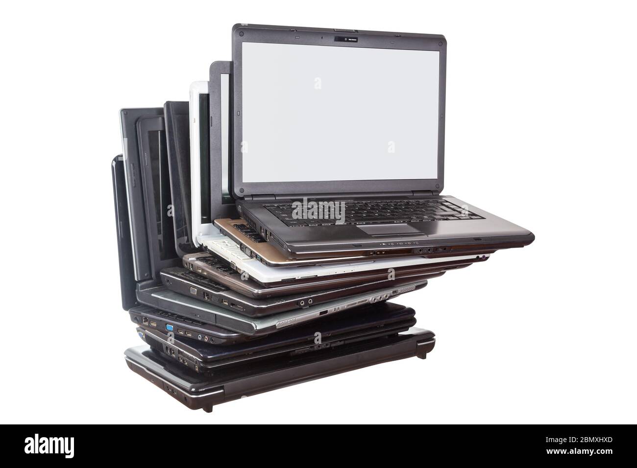 Stack of used laptops in different colors and models. Tha notebooks for repair and service. Stock Photo